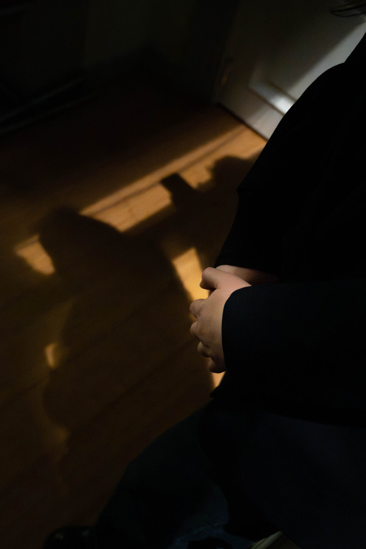 Hands clasped in prayer, Ukrainian church Brussels