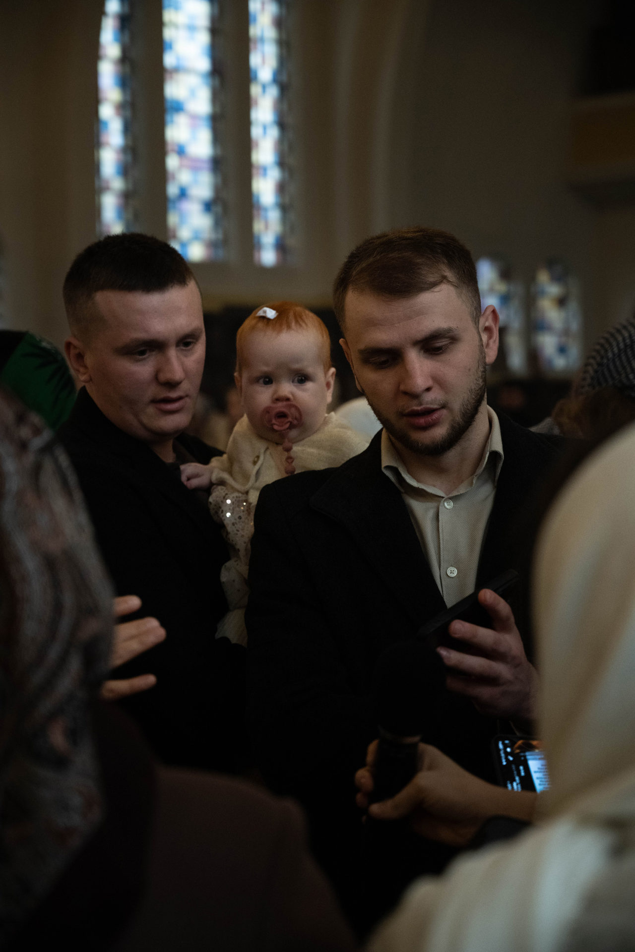 A father carries his daughter at Saint Joseph Church